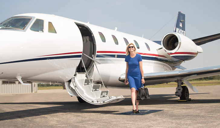 woman walking off plane