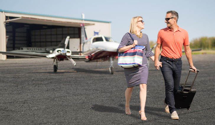 couple walking off plane