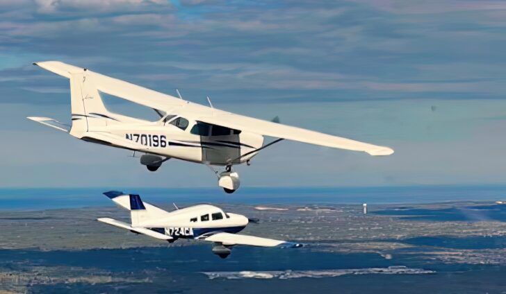 South Shore Flying Club’s low wing Piper Archer III and high wing Cessna 172 Skyhawk fly in formation. PHOTO/Karl Swenson