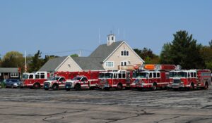 Marshfield Fire Department personnel visit with all types of vehicles that might be used in an airport emergency.