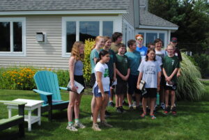 Scouts from Marshfield troops 101 and 424 gather outside the terminal building for their visit to Marshfield Municipal Airport. 