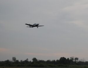 Tim Stiles flies past his family on his first solo flight. 