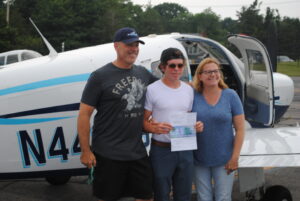Proud parents Mark and Julie Stiles congratulate their son Tim after his successful inaugural solo flights.