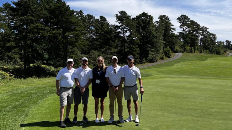 P.J. Flanagan, left, Steve Nery, Steve Swiech and Keith Douglass to help raise funds for the MBAA Aviation Scholarship Fund. Here, they surround Shoreline associate Erin Mulcahy.