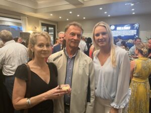 Lisa Scharoun, Keith Douglass and Erin Mulcahy have a blast at the 2023 BOSS Bash.