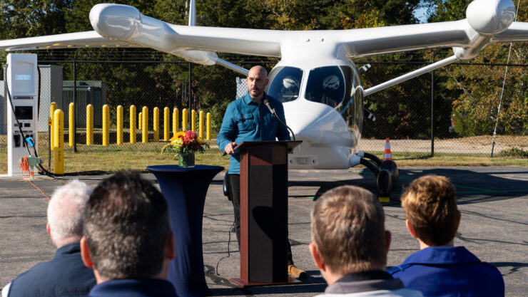 BETA Technologies COO Blain Newton addresses guests gathered for the ceremonial commissioning of BETA’s electric aircraft charging station at Marshfield Municipal Airport on Oct. 13, 2023. Photo courtesy of BETA Technologies