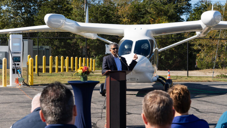 Tilak Subrahmanian discusses Eversource’s role in providing power for Shoreline Aviation’s electric charging stations made by BETA Technologies. Photo courtesy of BETA Technologies