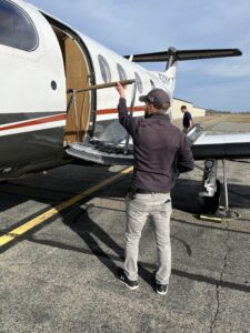 Line Service Manager Steve Dery lowers the cockpit stairs of the Pilatus PC-12NG.