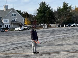 Line Service Manager Steve Dery serves as the marshal to direct the Pilatus PC-12NG from the ramp to the taxi runway. 