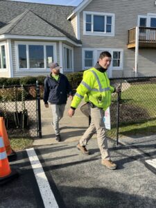 Assistant Airport Manager Ben Garman, front, and Line Service Manager Steve Dery depart the Marshfield Municipal Airport terminal building to begin aircraft preparations for the day’s charter flights. 