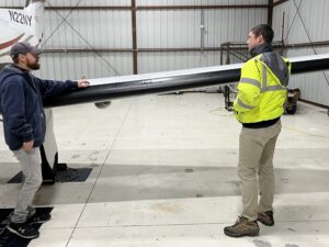 Line Service Manager Steve Dery, left, and Assistant Airport Manager Ben Garman inspect the Shoreline Aviation charter fleet’s Pilatus PC-12NG as part of their preflight preparations. 