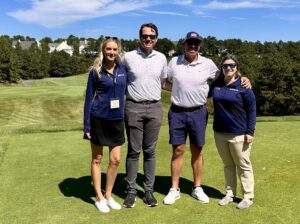 Erin Mulcahy, left, enjoys the 2024 Scholarship Golf Tournament with MBAA board members.