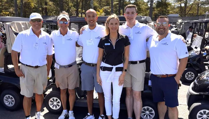 Erin Mulcahy poses with the Shoreline team during the 2024 MBAA Scholarship Golf Tournament held at Pinehills Golf Club.