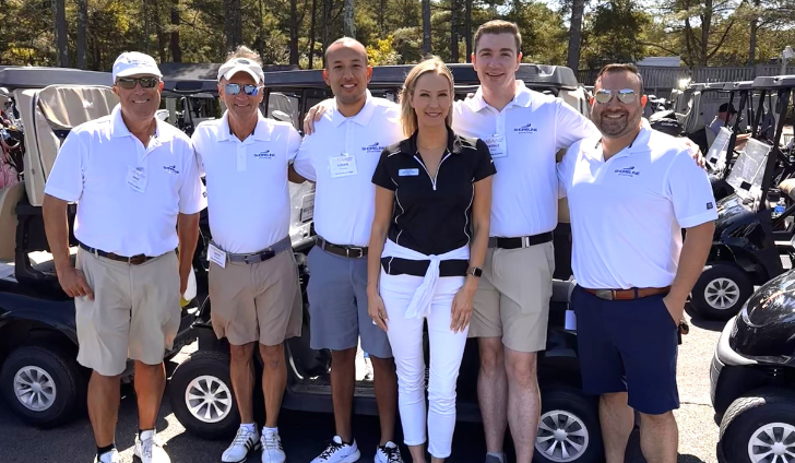 Erin Mulcahy poses with the Shoreline team during the 2024 MBAA Scholarship Golf Tournament held at Pinehills Golf Club.