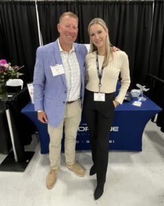 MBAA President Dave Richter and MBAA Board Secretary Erin Mulcahy take a moment at the Shoreline Aviation booth.