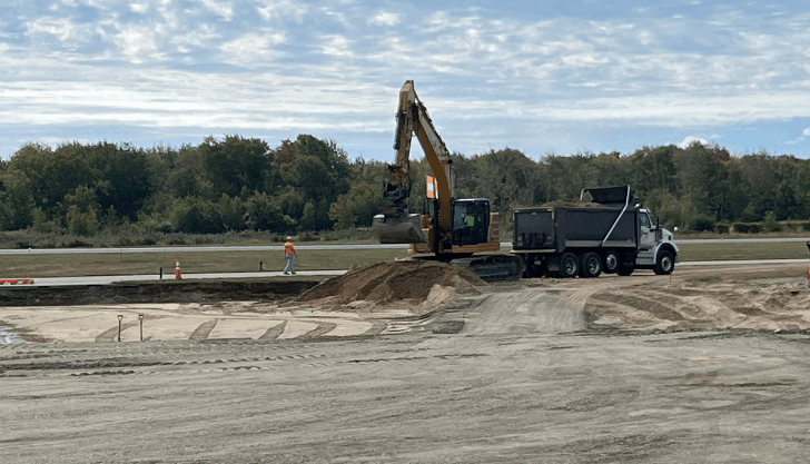 ASG’s resident project representative Nick Prescott follow the progress of final grading work.