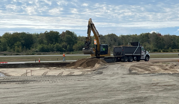 ASG’s resident project representative Nick Prescott follow the progress of final grading work.