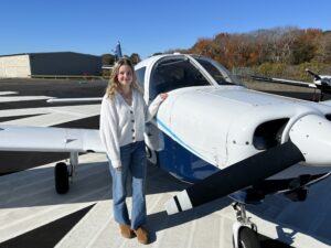 Abby Marinelli, front left, Andrea Hewett, Isabella DiRusso, back left, Helen Lin, and Varvara Karenski have all flown this Piper Warrior trainer.