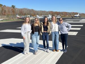 Varvara Karenski, left, Andrea Hewett, Isabella DiRusso, Abby Marinelli, and Helen Lin have become fast flying friends through Shoreline Aviation’s flight school.