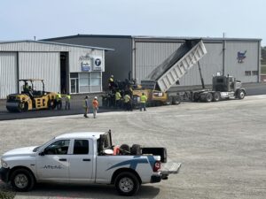 Hot asphalt is loaded into the paver. 