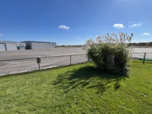 It’s an unusually quiet day on Marshfield Airport’s ramp. 