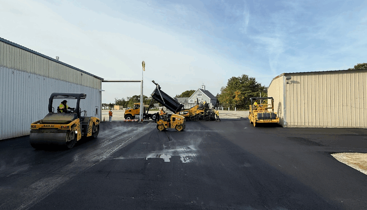Paving begins next to the maintenance hangar.