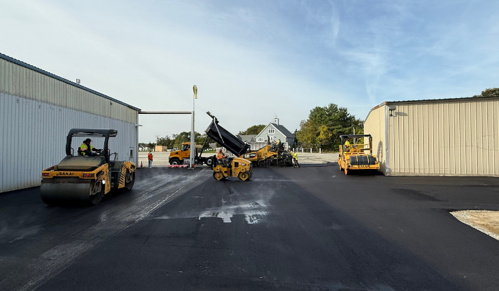 Paving begins next to the maintenance hangar.