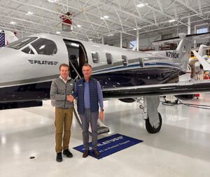 Shoreline Aviation President Keith Douglass, right, takes delivery of the new Pilatus PC-12 NGX from Mike Kenny, of ProStar Aviation of Londonderry, N.H.