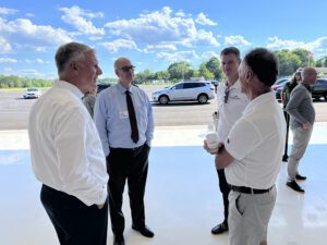 South Shore Chamber President Tim Cahill, left, SSCC Government Affairs & Policy Director Eric Dykeman, Shoreline Aviation General Manager Travis Bart, and Shoreline President Keith Douglass chat during the Chamber Business After Hours held June 24 at Shoreline. 
