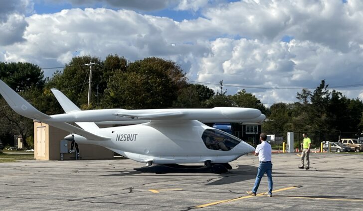Shoreline Aviation President looks over the BETA Technologies all-electric ALIA 250, which had just flown into Marshfield Airport.